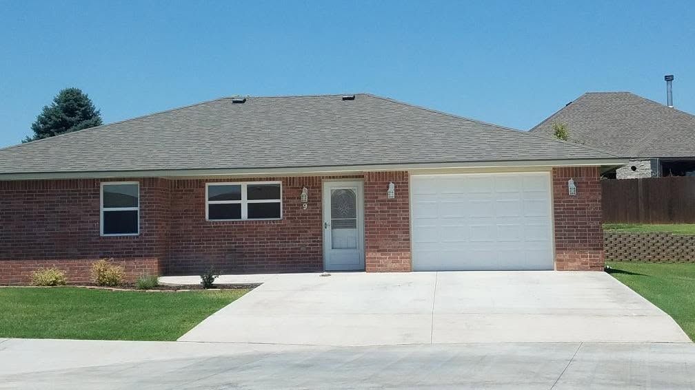 White garage door on a new brick home